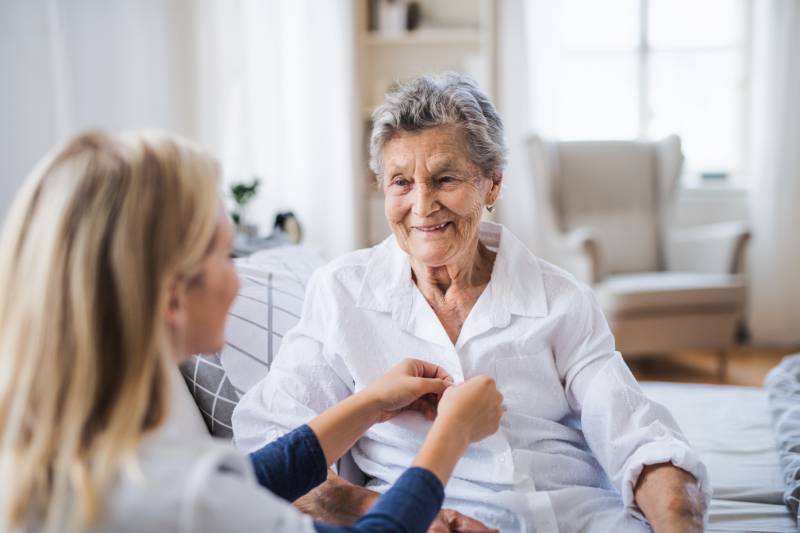 Caregiver assisting elderly